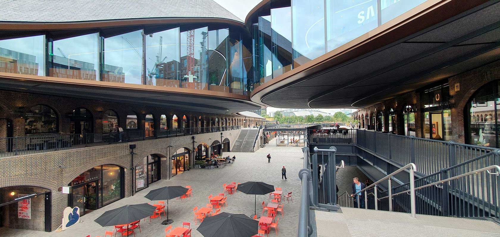 Modern shopping center courtyard with seating areas
